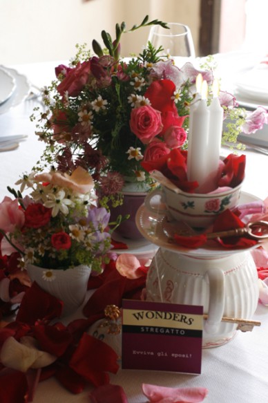 Tea pots, candles, tea bags and flowers